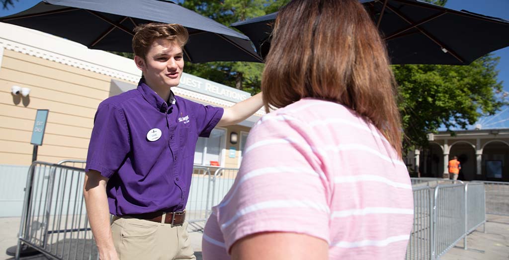 Employee helping a guest
